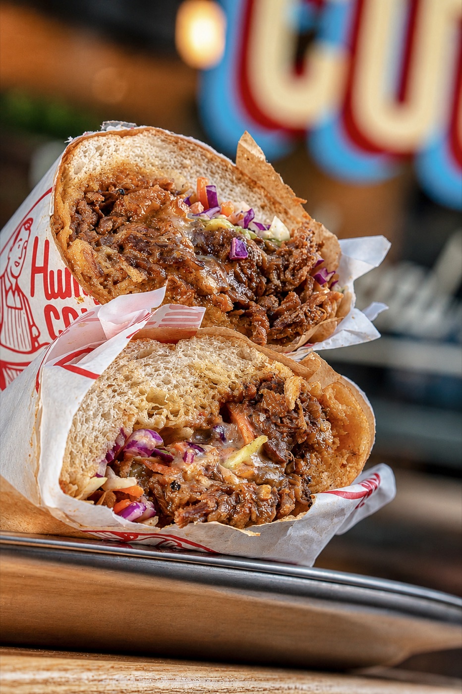 humphrey's counter — pulled-pork sandwich, halved