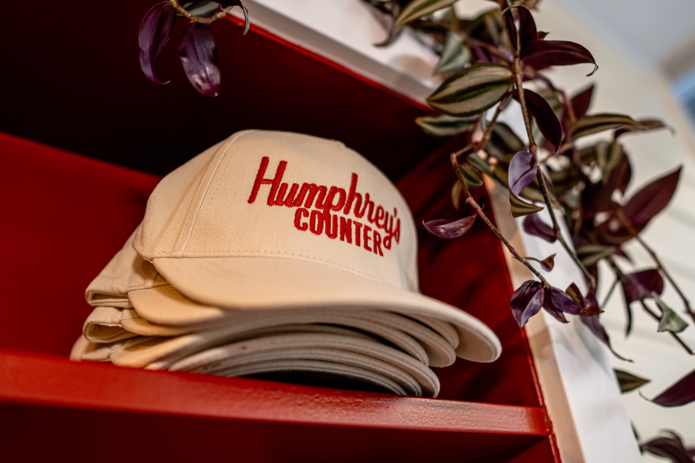 humphrey's counter — branded caps on the shelf