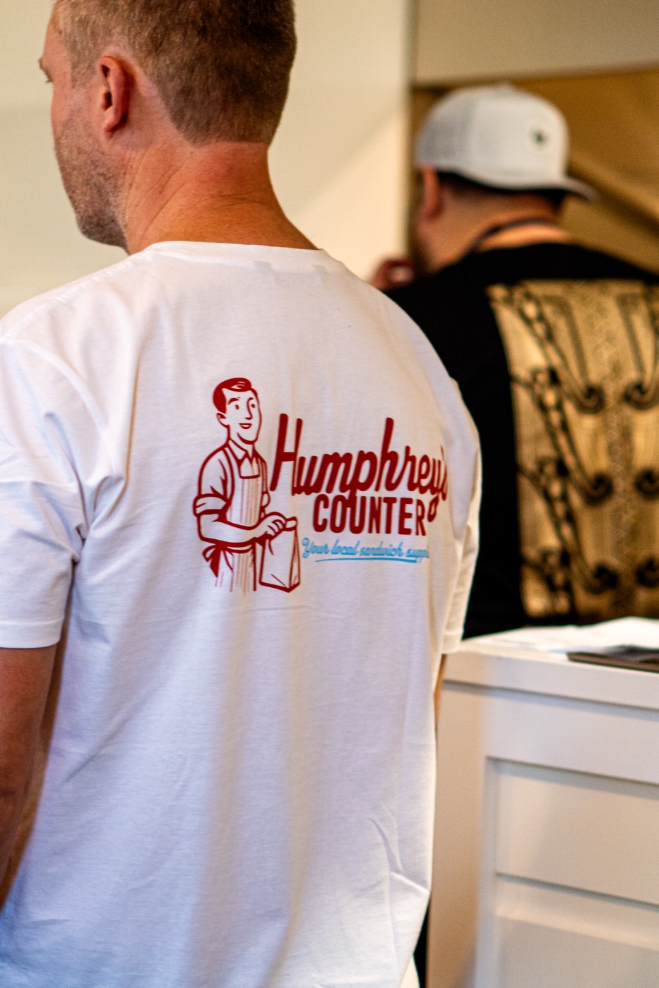 humphrey's counter — staff tee with the mascot mark